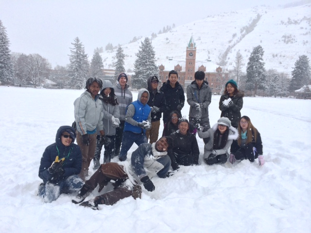 International Students pose for photo on the snowy UM quad