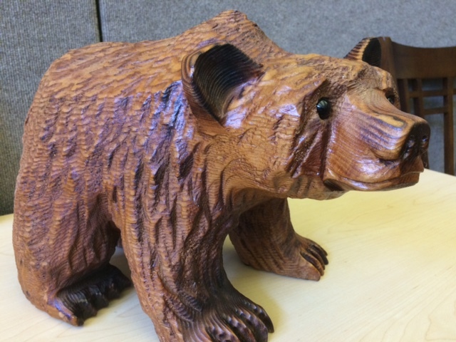 A carved wooden grizzly bear.