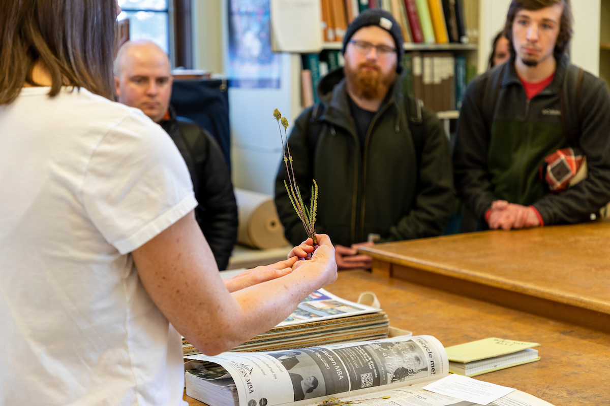 Photo of professor with plant