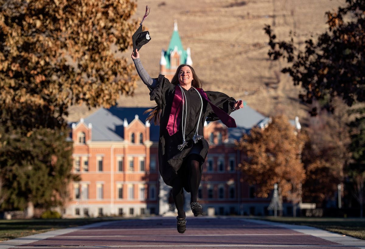 Photo of UM graduate on Oval