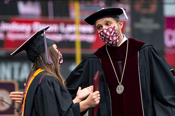 Photo of President Bodnar and graduate
