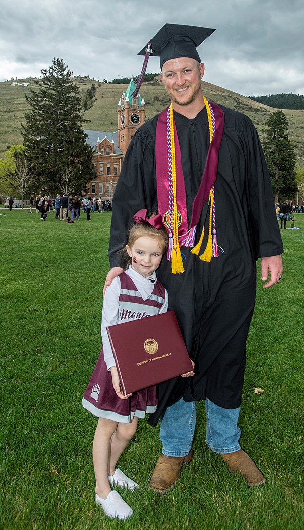 Photo of UM graduate with family