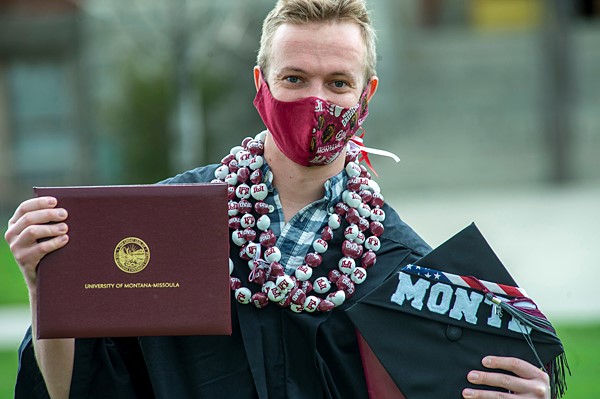 Photo of UM graduate with mortarboard