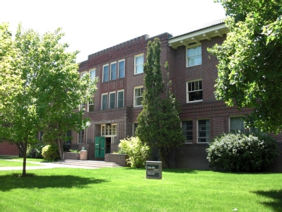 Image of the outside of Turner Hall showing the main entrance, the hall is three stories tall, and is made of brick.