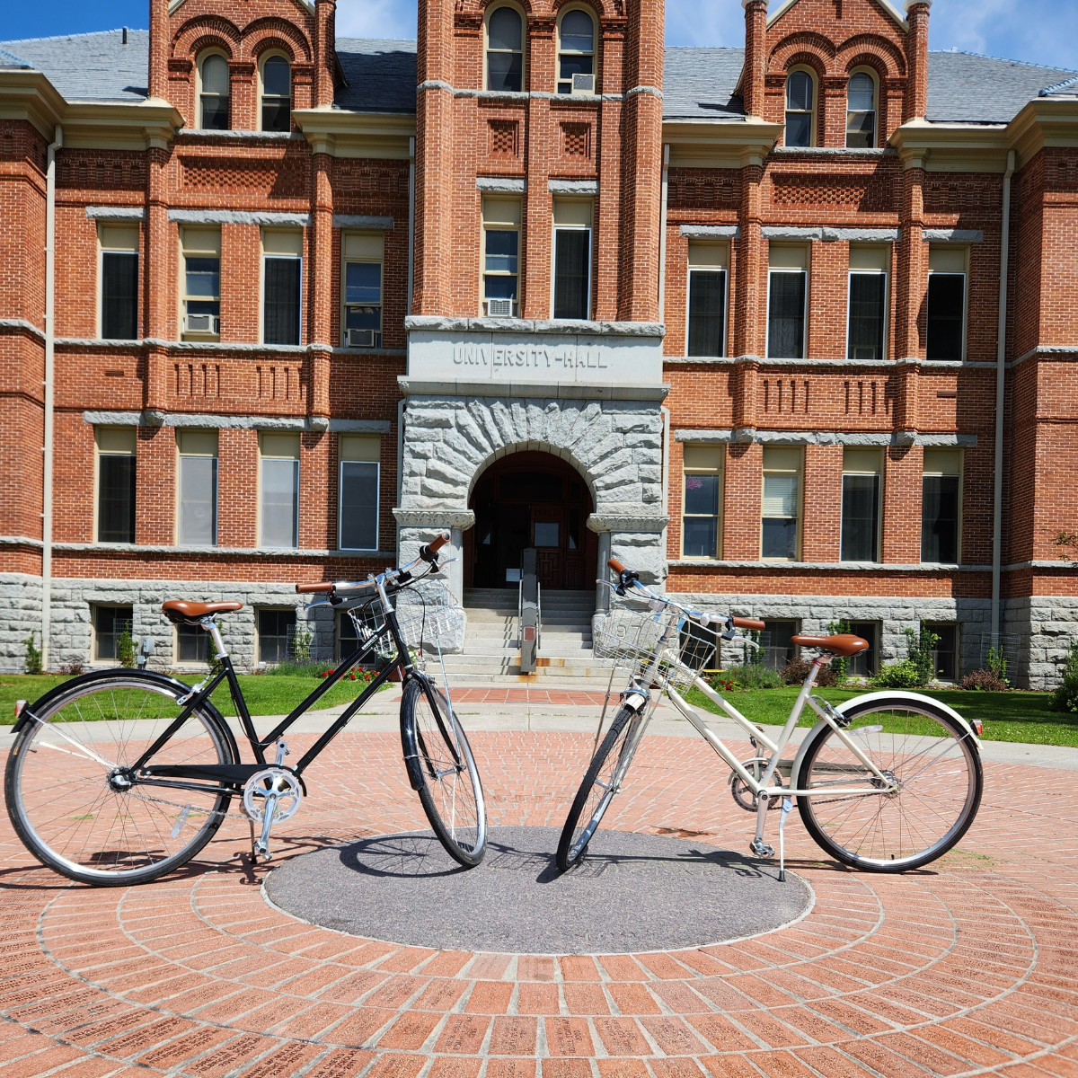 two bikes sit in front of University Hall
