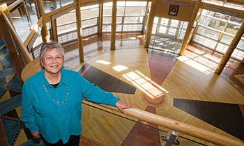 UM tribal liaison Linda Juneau stands on the second floor of the center’s distinctive circular atrium.