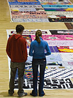 Studens viewing the AIDS Memorial Quilt at the Adams Center