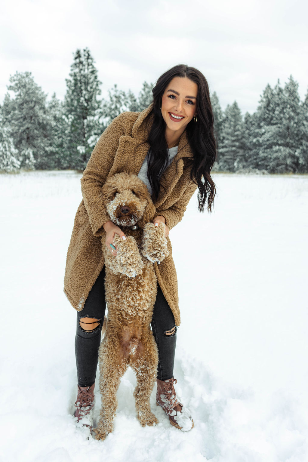 Skyler Anderson with her dog in the snow.