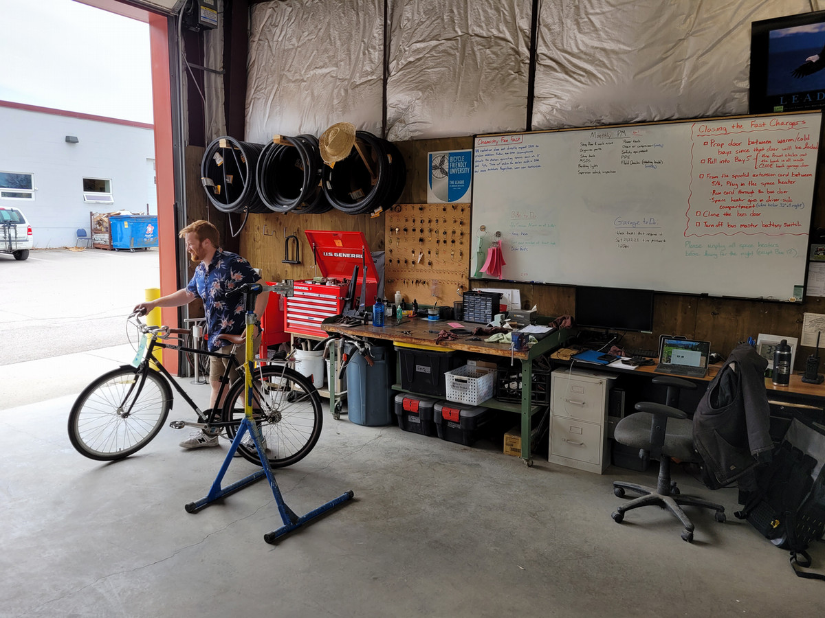 bike mechanic works on bike