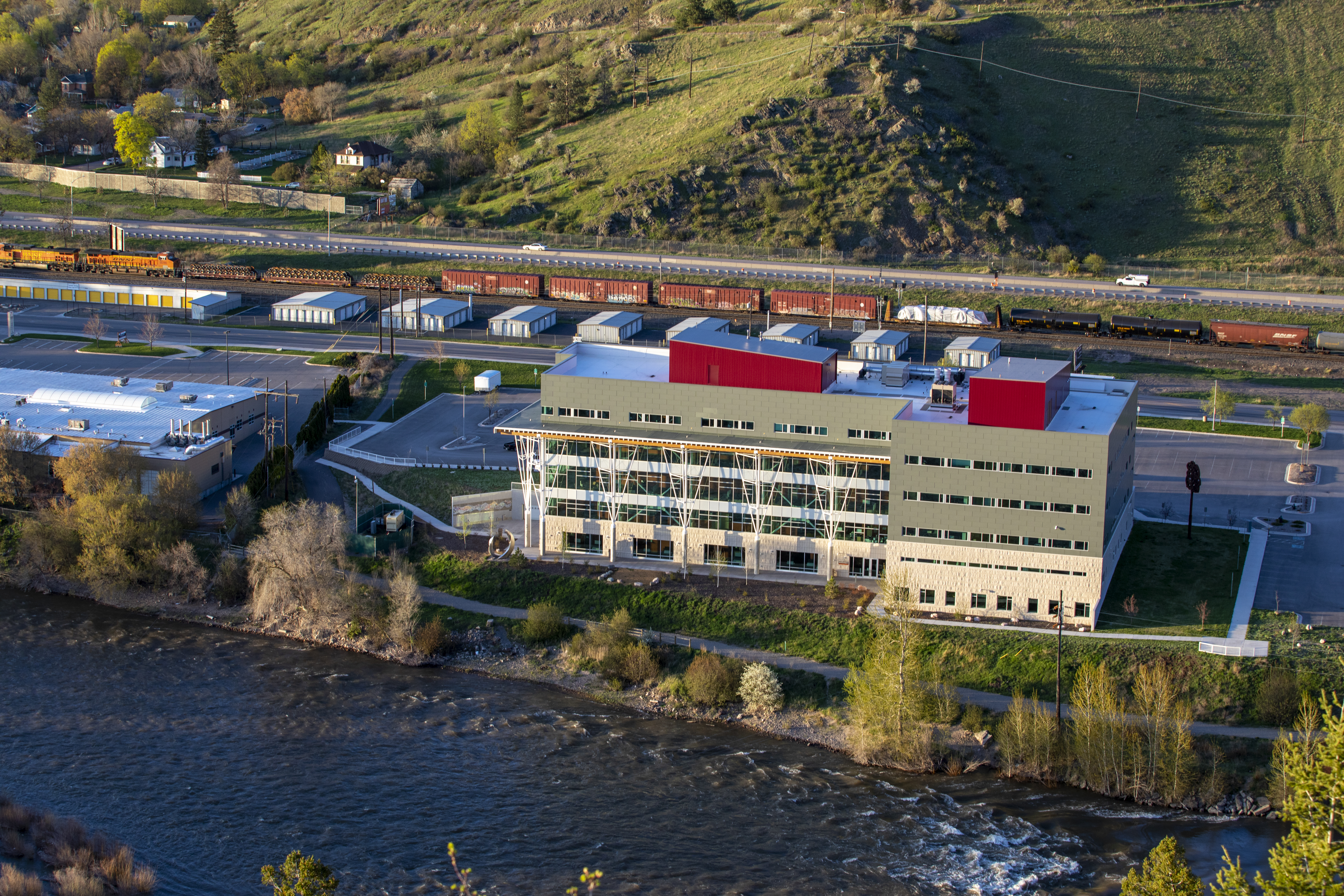 aerial view of missoula college campus from above the river