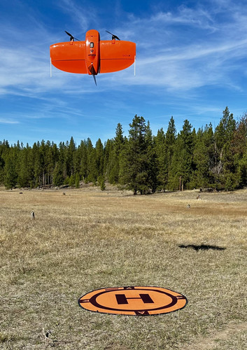 wingtra drone hovering over launchpad
