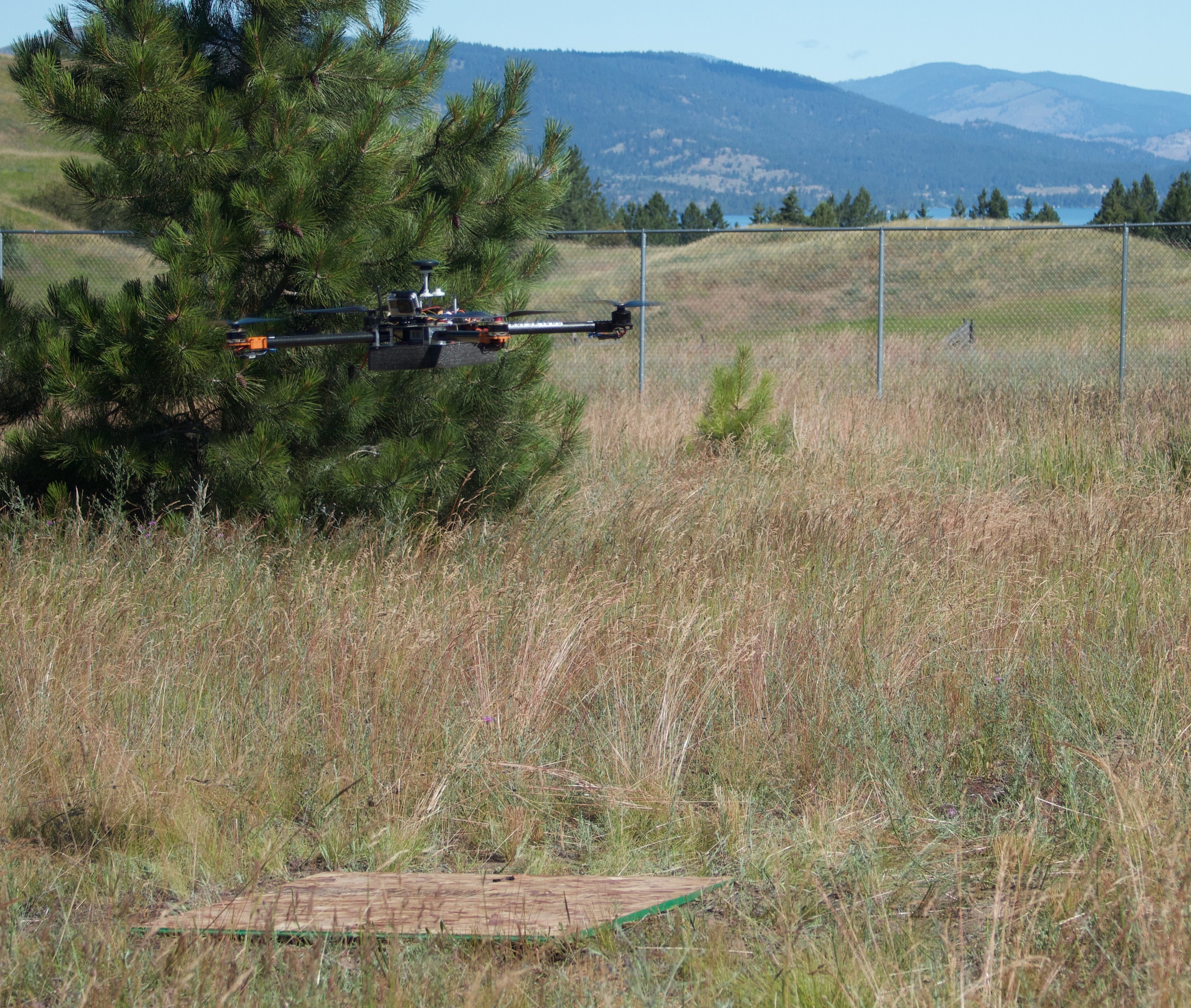 drone hovering over the ground