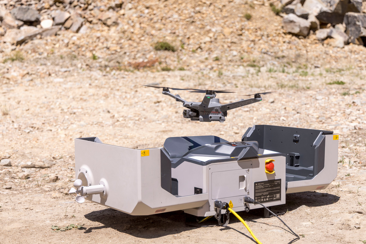 drone taking off from box that has opened up