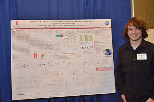 James presenting his poster