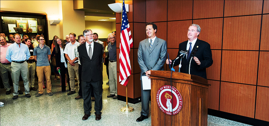 The president of the university and the governor presiding over award ceremony