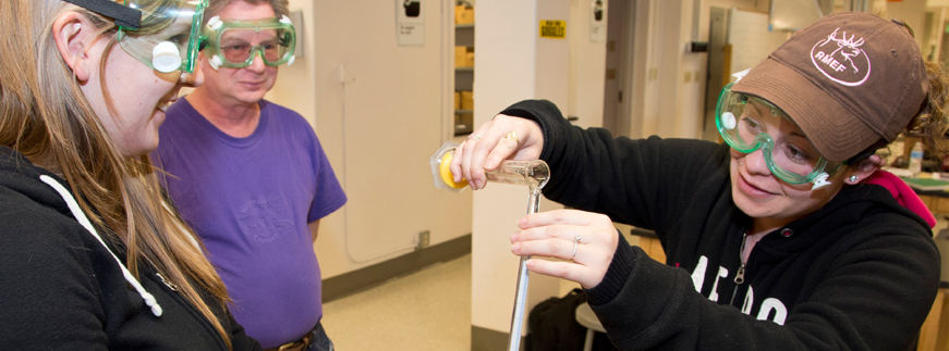 three studnets working in the lab