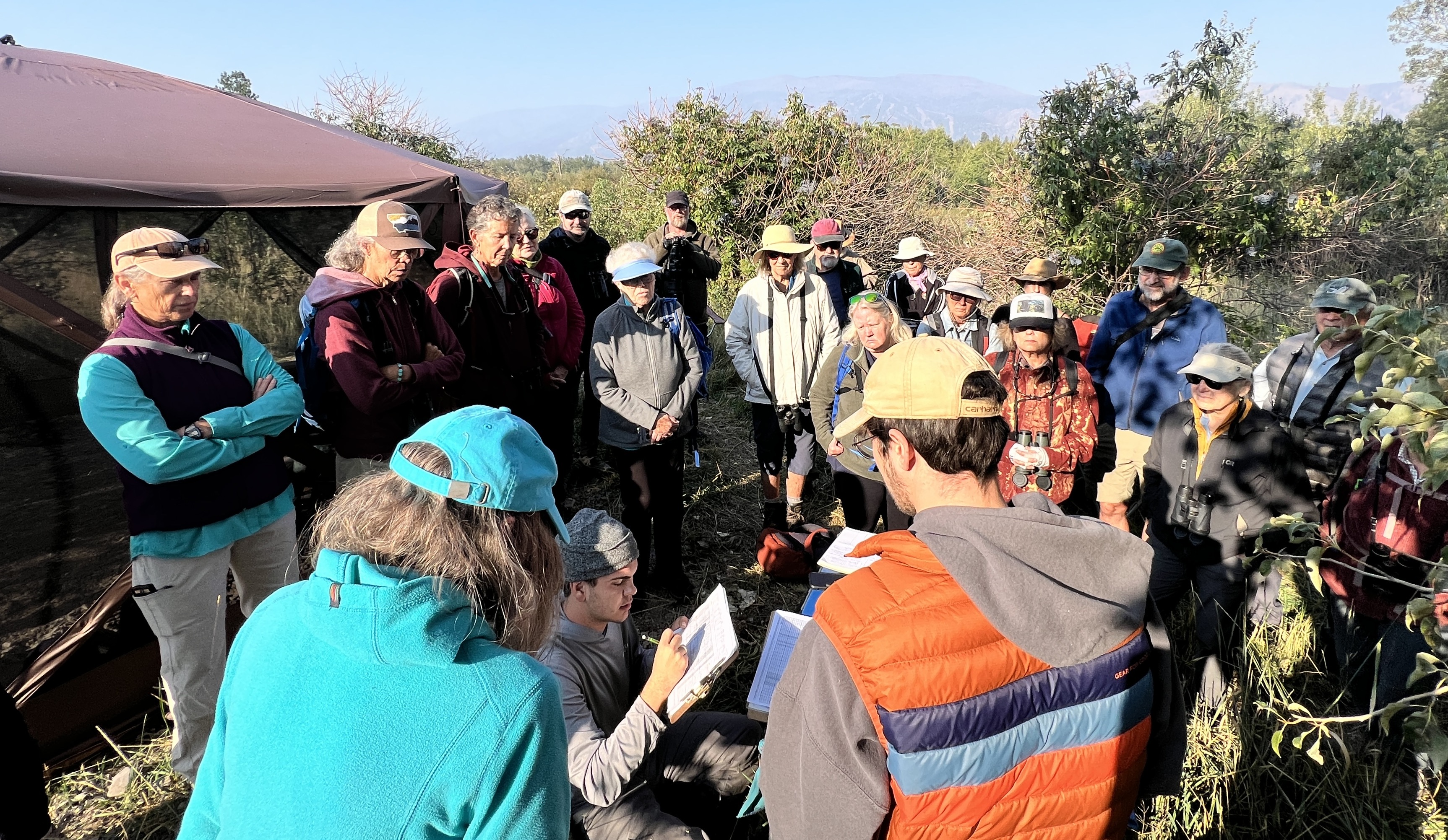 Five Valleys Audubon group members watching a banding demonstration.