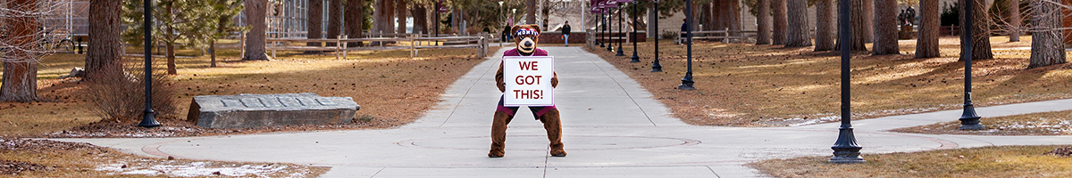 UM Mascot Monte Bear holds a sign that reads "We Got This"