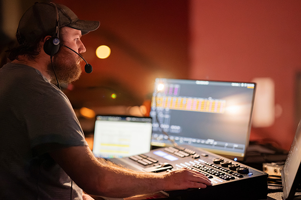 Student works the sound design of a theatre production at UM