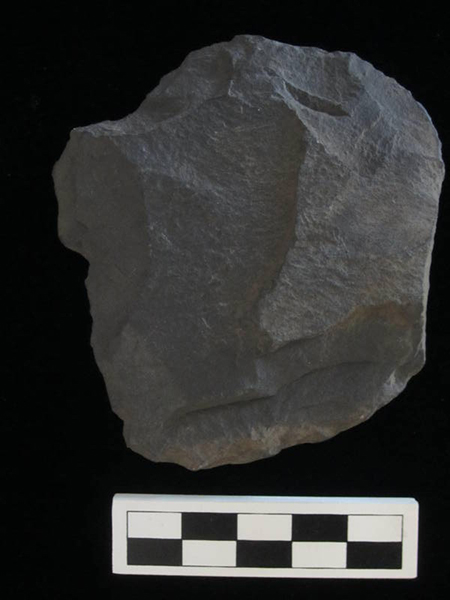 Stone (slate) chipped scraper with small stem