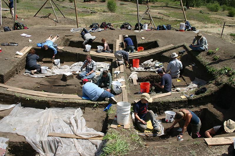 large group of people working on an excavation