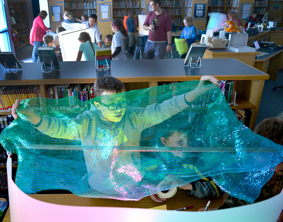 Child doing light play activity in a school library