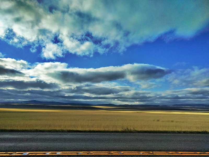blue sky with clouds and the open road blue sky with clouds and the open road