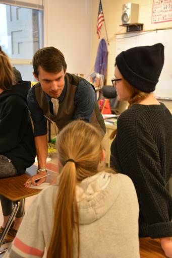 guest teacher speaking with two students guest teacher speaking with two students