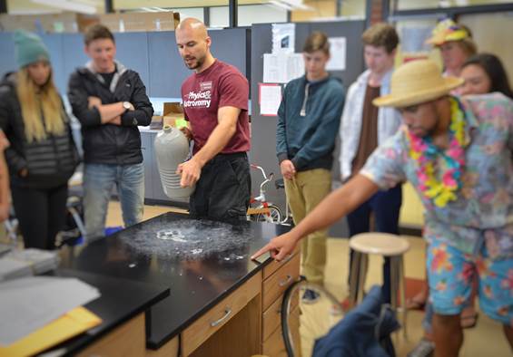 c Mark demonstrating an experiment to students