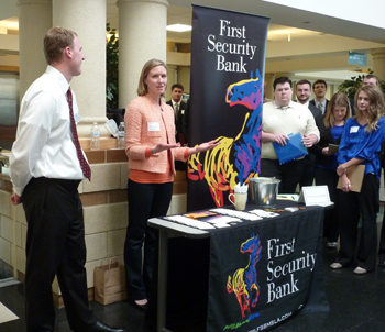 First Interstate Bank representative at info booth during Finance Opportunity Night