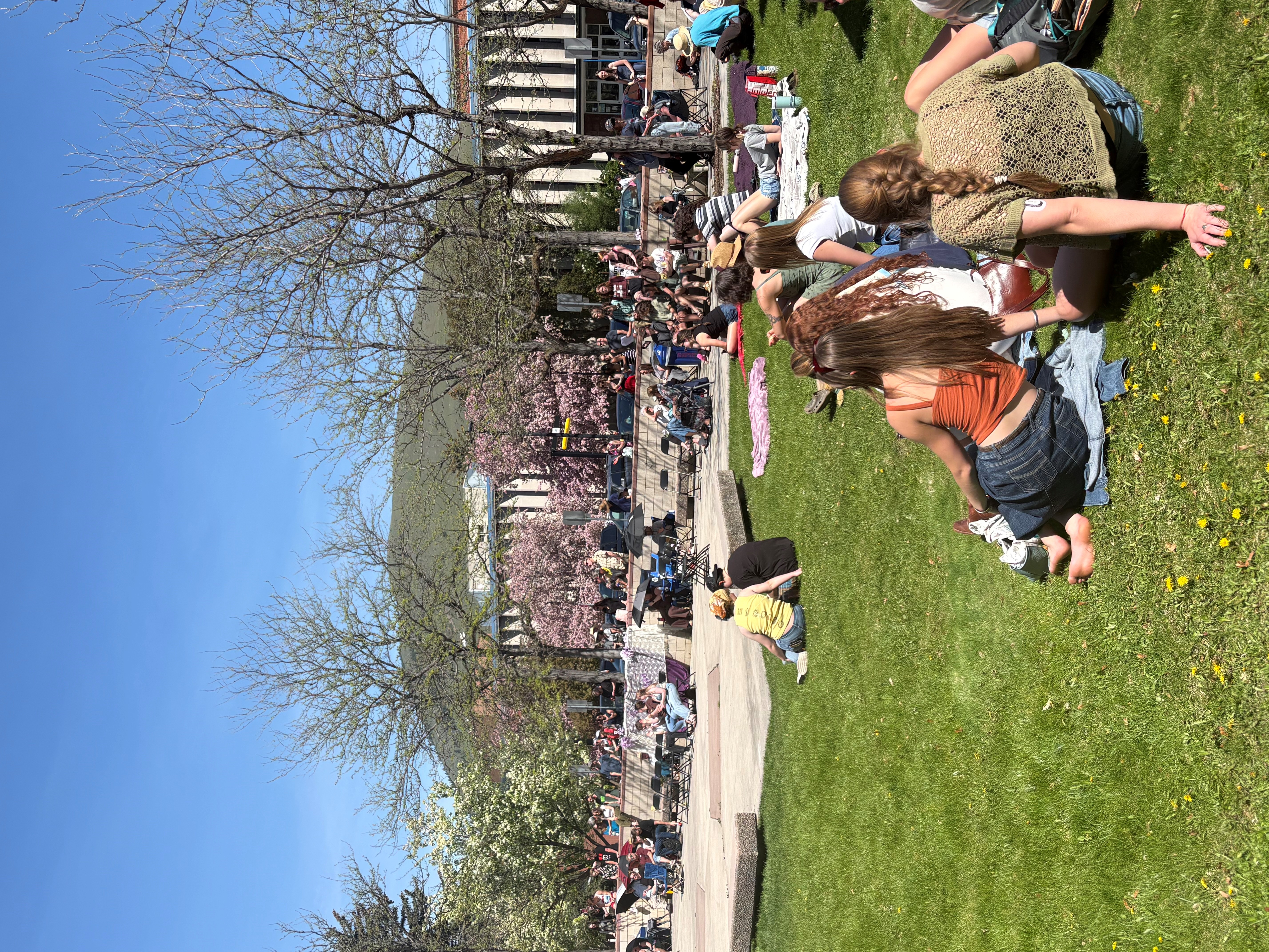 People gathered around the College of Business Stage in the Gallagher Business Building Courtyard to enjoy the music from the inaugural Lilith Fair Tribute Concert.