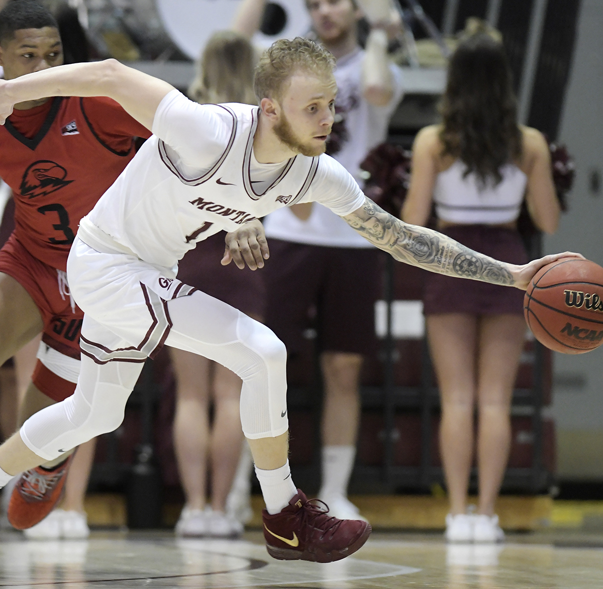 Basketball player dribbling ball during game