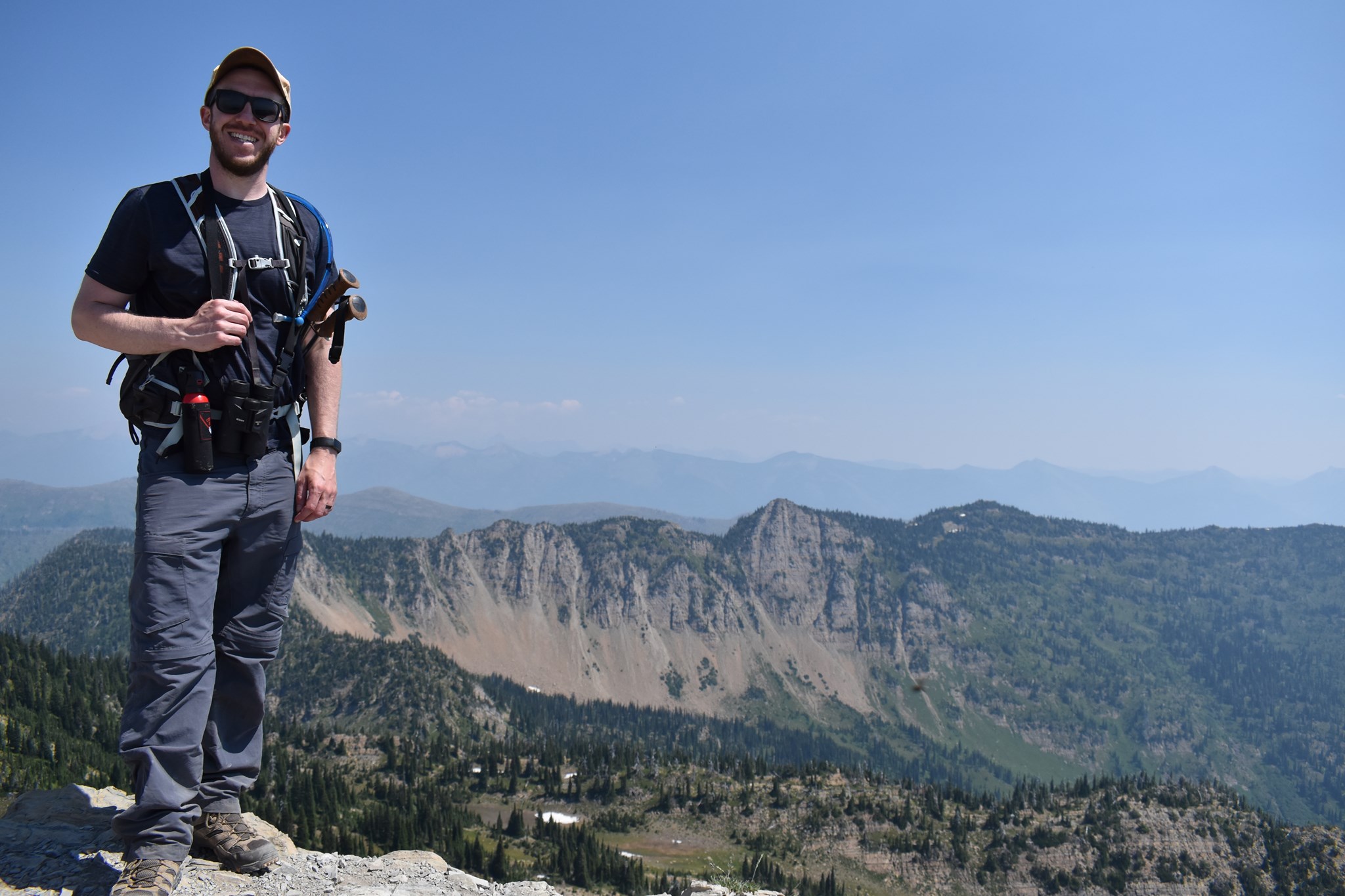 photo of Matt overlooking a scenic mountain view.