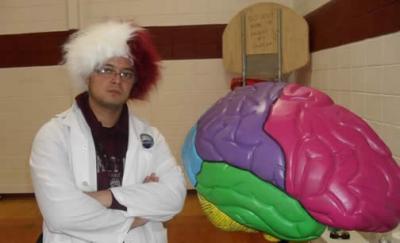 Neuroscience graduate student Juan Palacios-Moreno poses with the colossal brain before meeting with middle school kids in Victor MT
