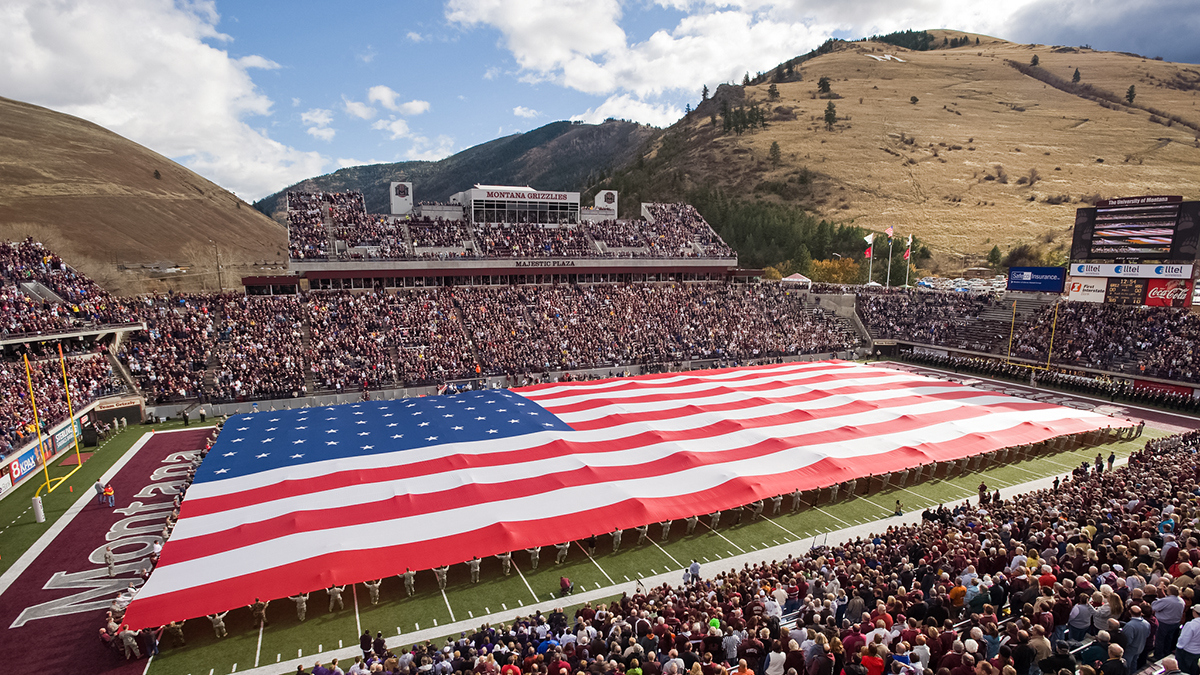 US flag stretched the entire length of the Washington Grizzly Stadium
