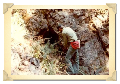 Forest Service worker looking at rock formation