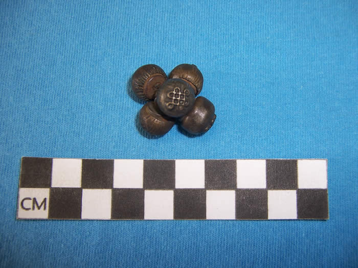 brass button with endless knot