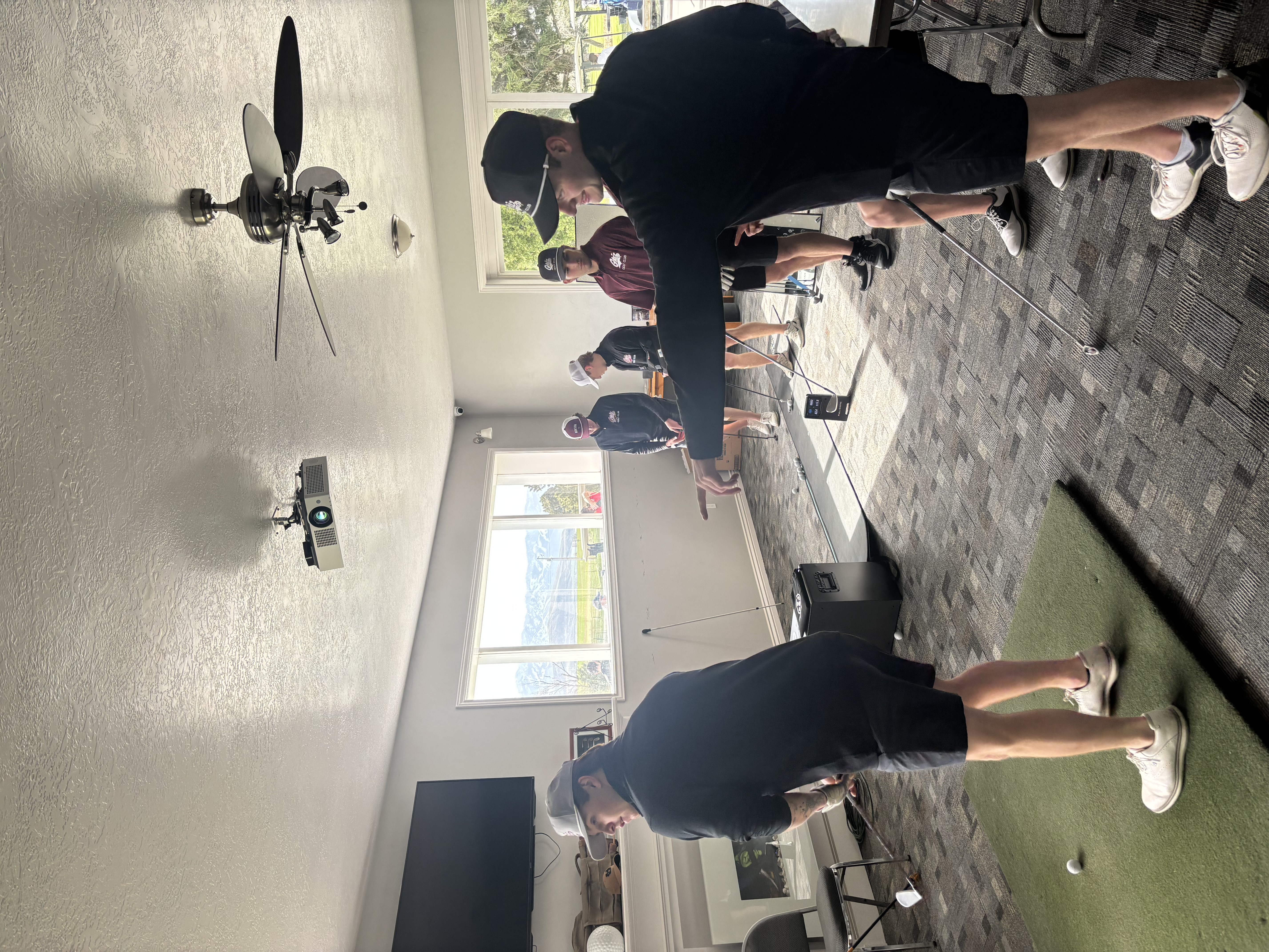 Griz Golf players warming up in club house