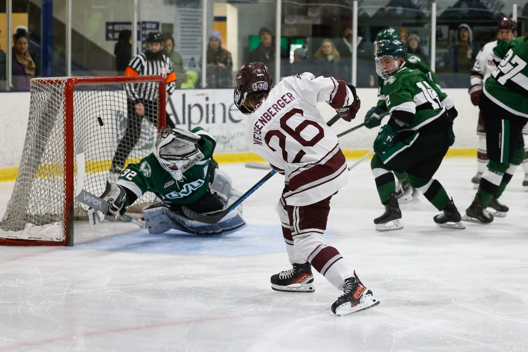 Griz Hockey Player Scoring a Goal Against Williston State