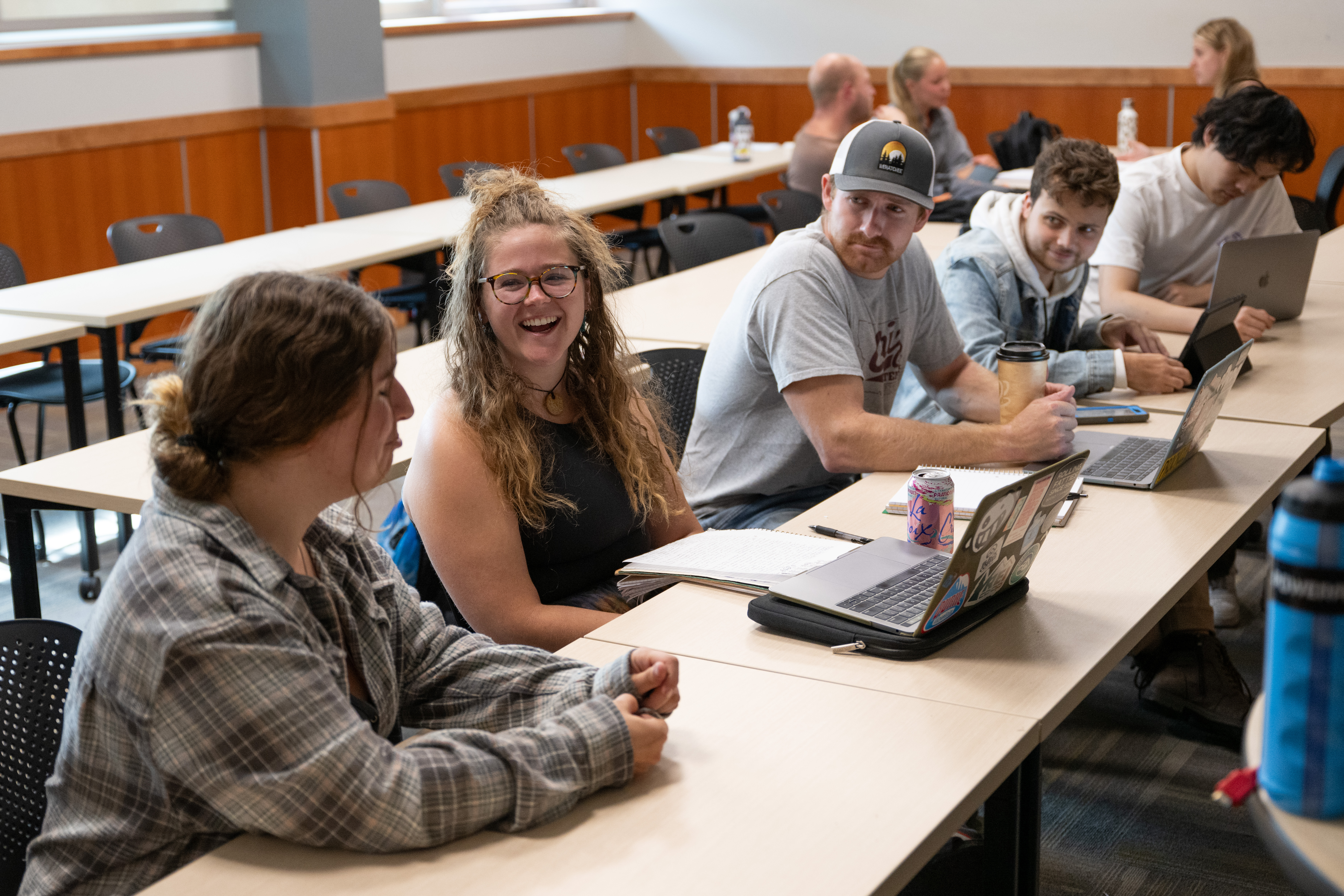 Students in a classroom engage in a rich discussion. 