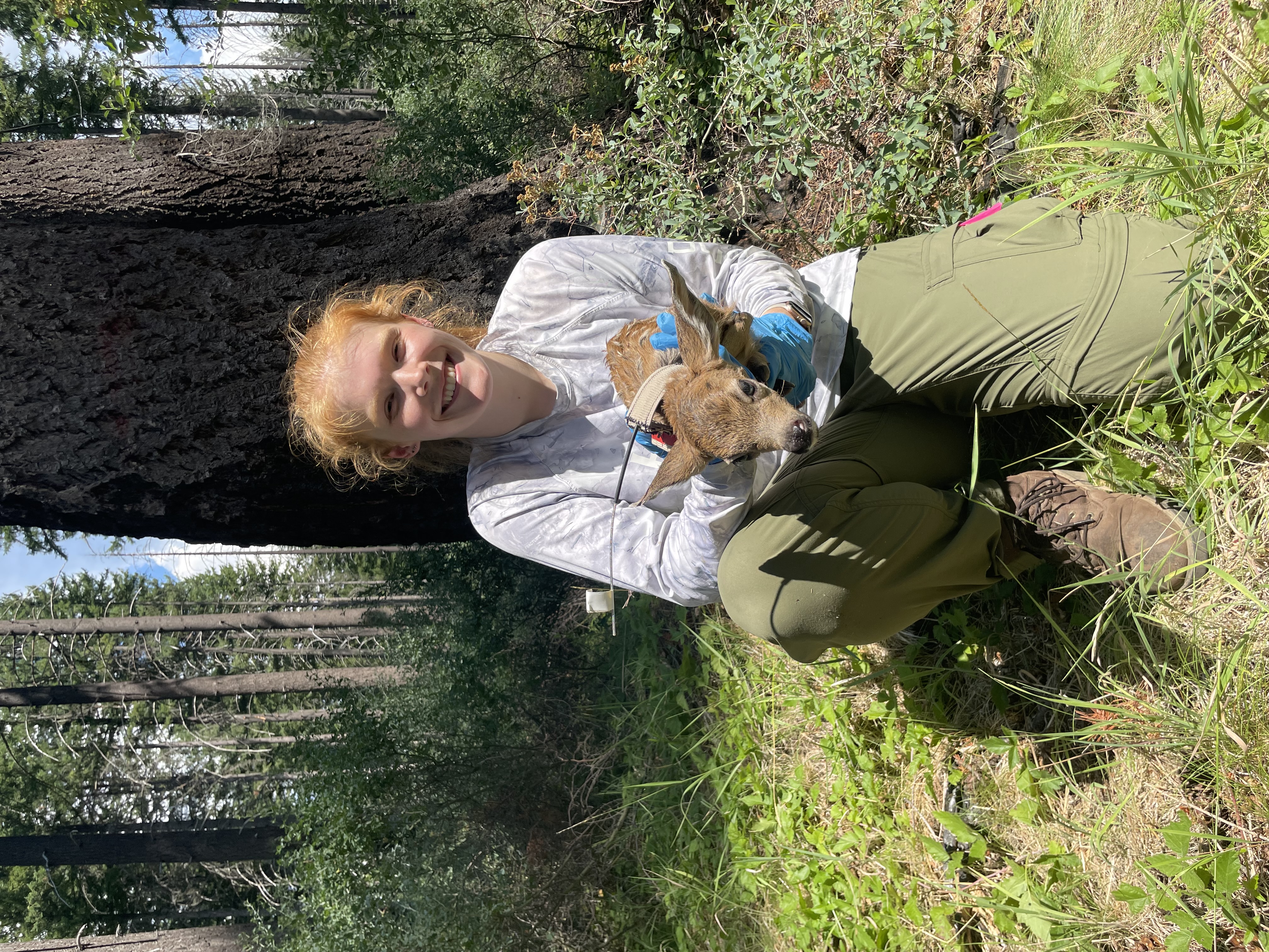 Britney holding a deer fawn