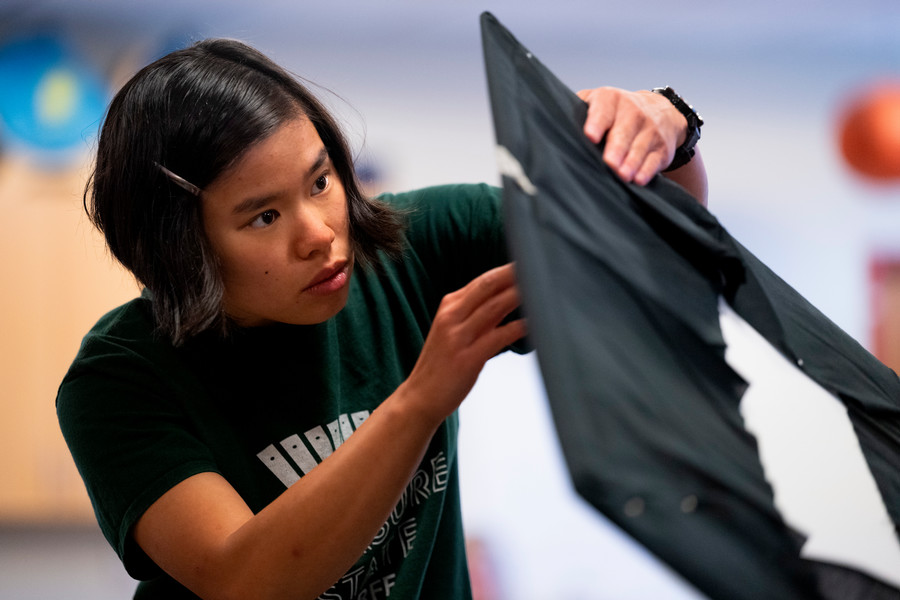 student working on an art project