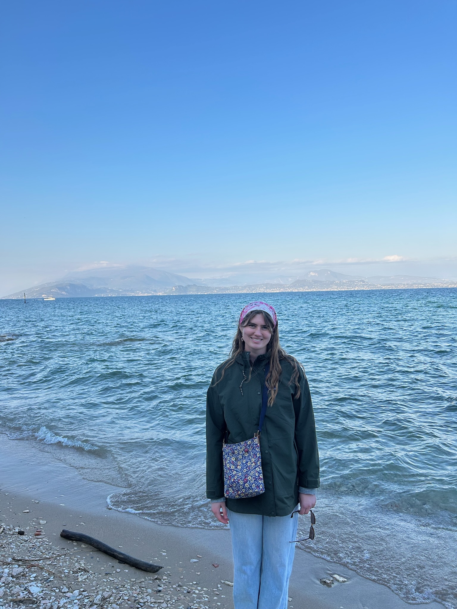 Dylan Vanrossum, Wellbeing Support Coach, pictured at a beach.