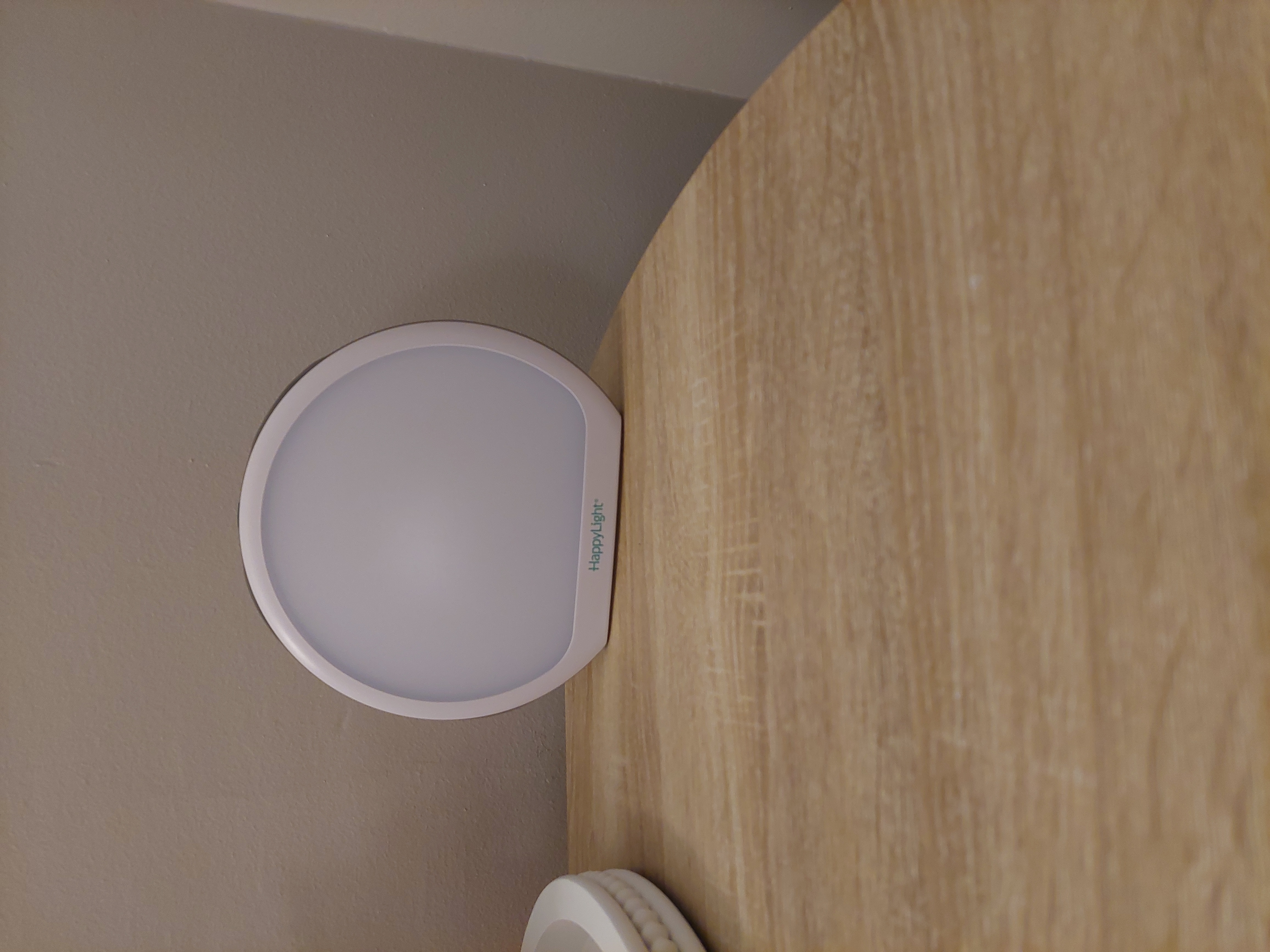 artificial sunlight lamp on top of a shelf