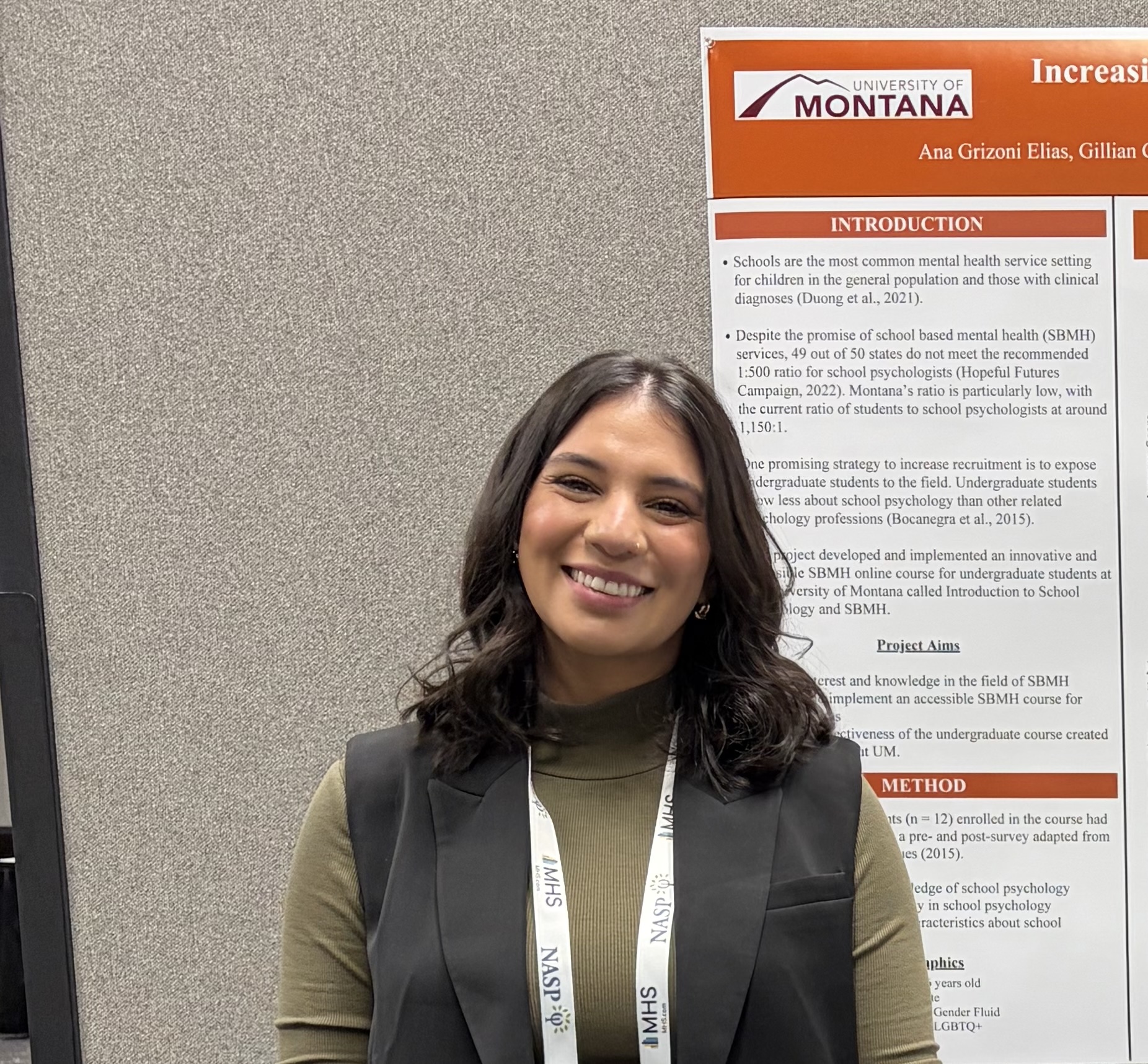 picture of ana in front of a poster
