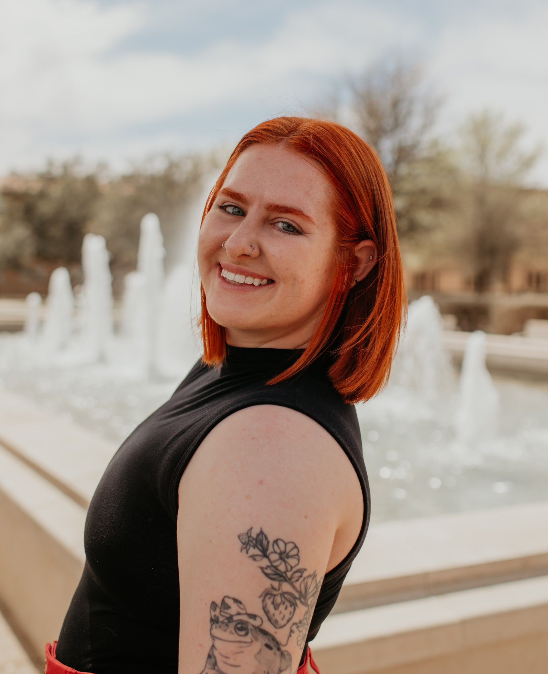 Picture of Ash Peters in front of a water fountain outside