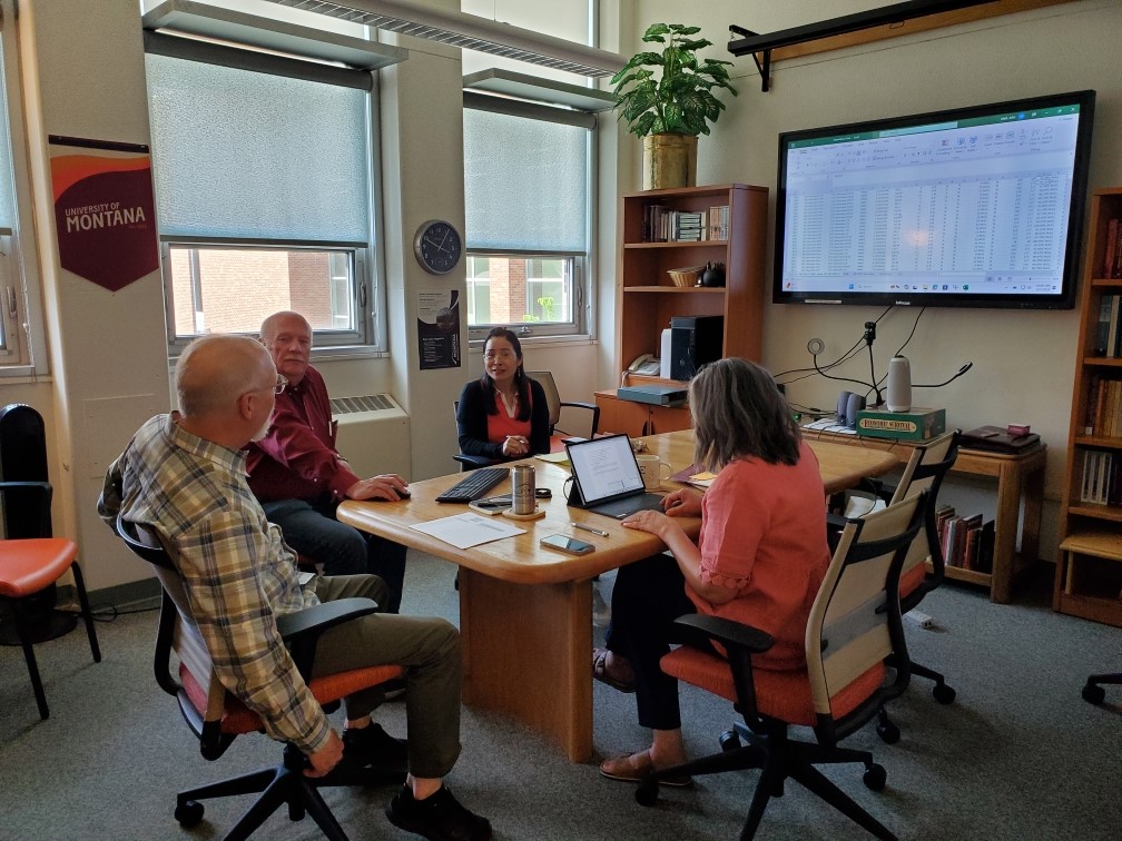 UM Department of Educational Leadership meets to work on their summer research projects.