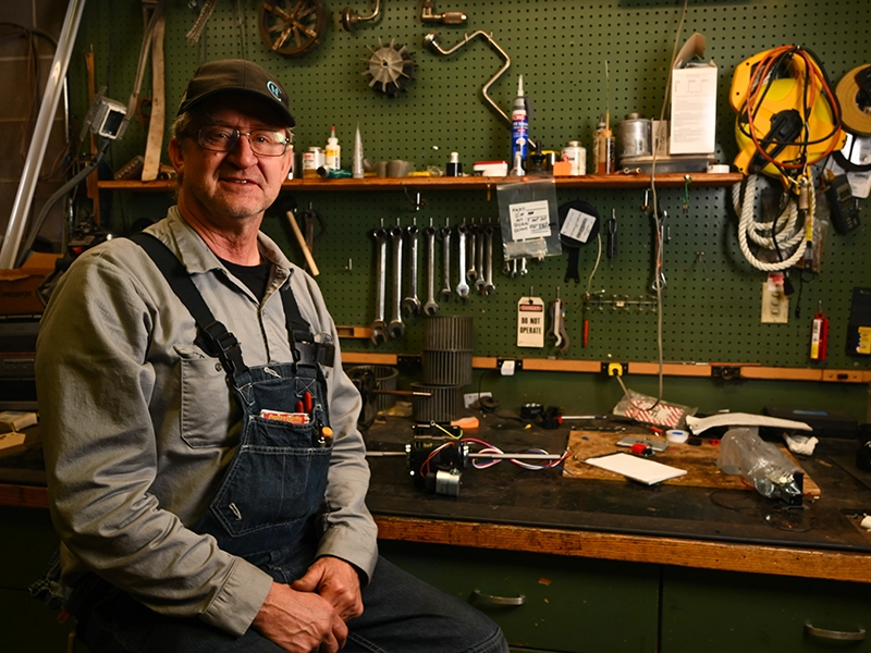 Jim lyon sitting at workshop