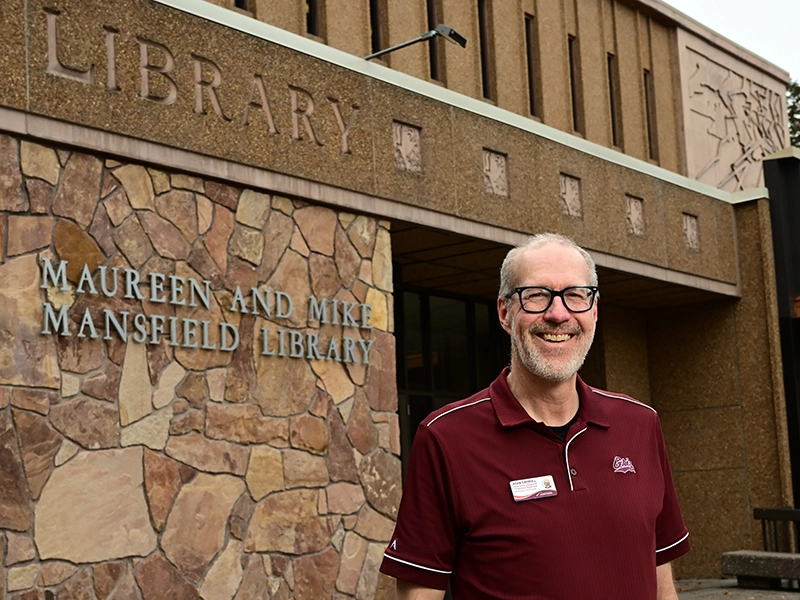 Adam Carroll in front of the library