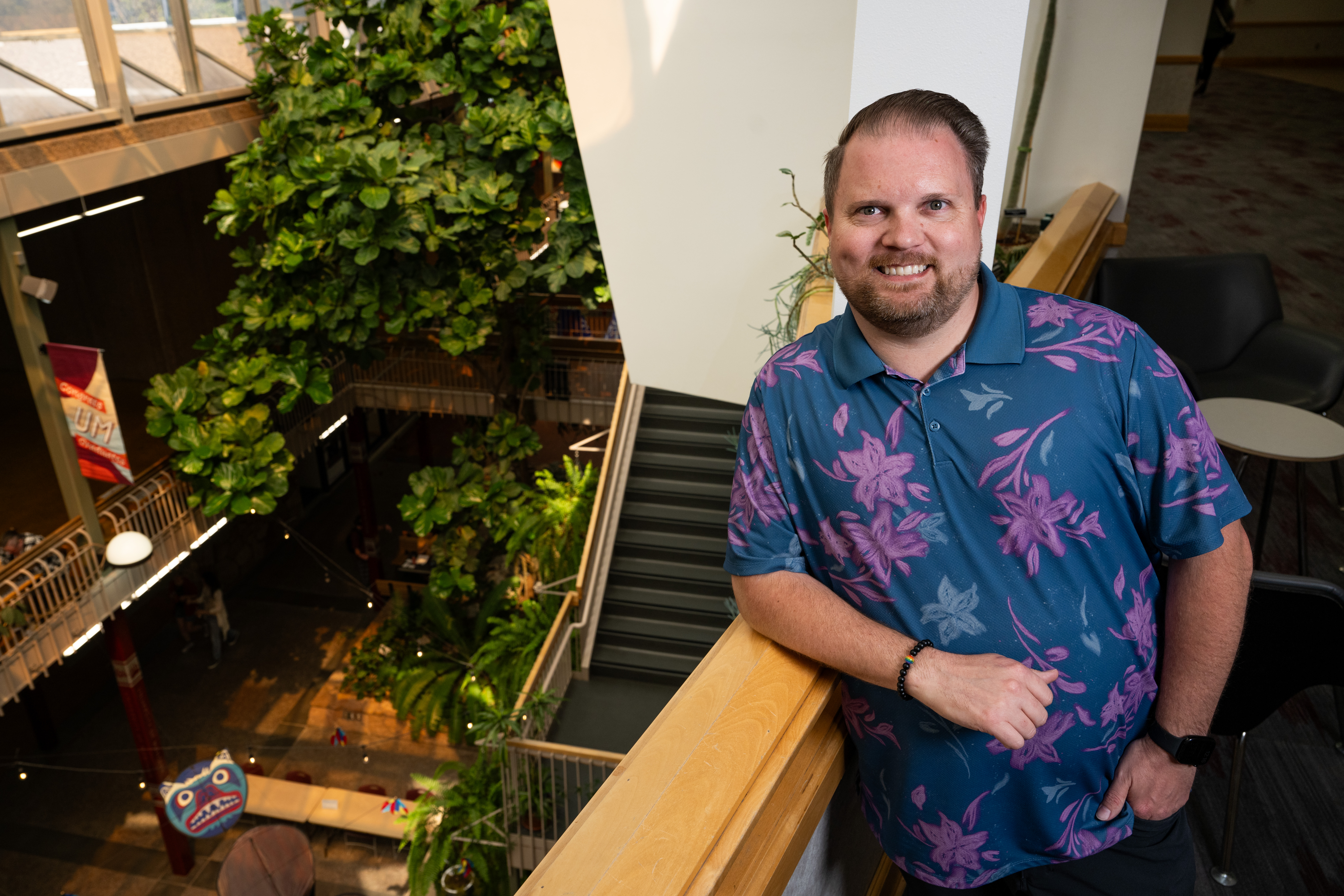 Kevin Harding standing above the University Center atrium.